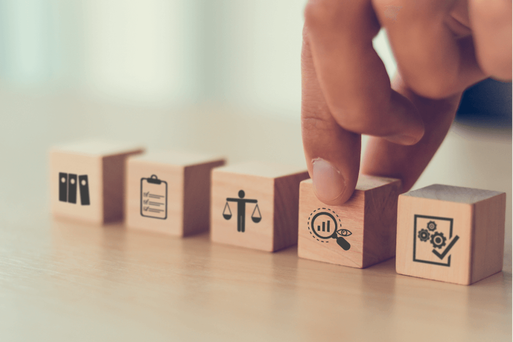 Wooden Blocks with Icons related to Audit on them